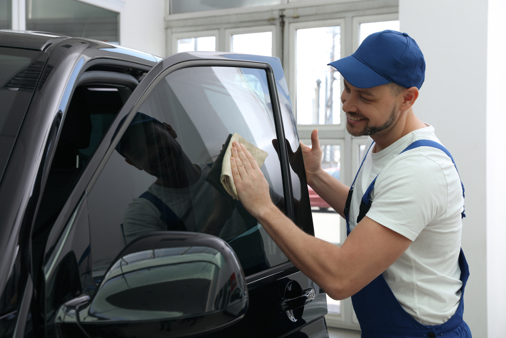 Car window tint installer is happy of the output