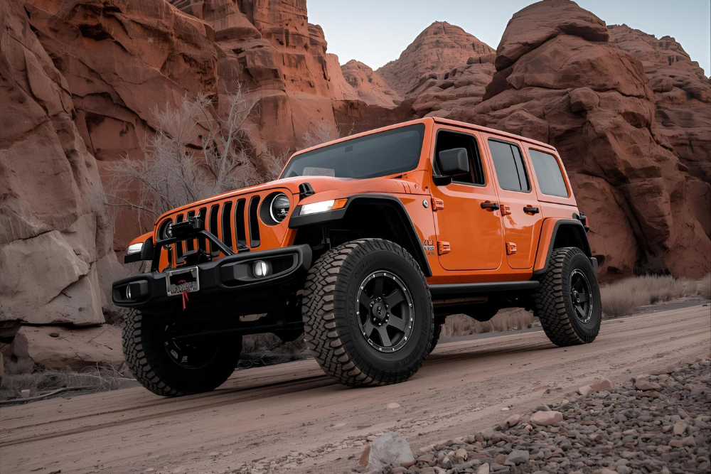 Orange suv parked along the mountainous road