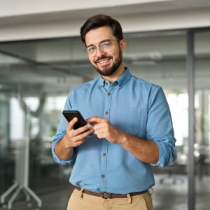 Smiling,Busy,Professional,Latin,Business,Man,Standing,In,Office,Holding